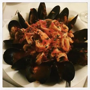 Seafood - seafood marinara shrimp clams muscles calamari over a Linquine pasta in a marinara sauce