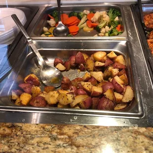 Sides were roasted red potatoes and steam veggies plate came with a roll.