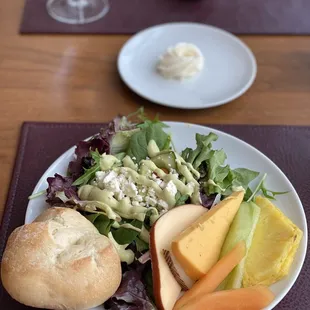 Salad and fruit and cheese plate