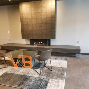 a modern living room with a fireplace