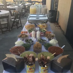 Wedding white linen mirrored salsa bar set up