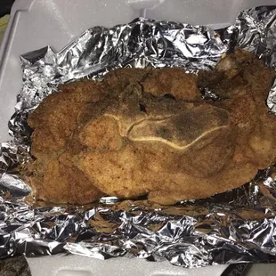 a fried chicken in foil