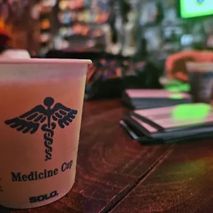 a plastic cup with a logo on it