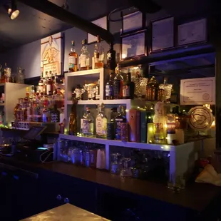 a bar with bottles of alcohol