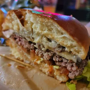 Cross-section of that juicyyyyy perfectly cooked burger!