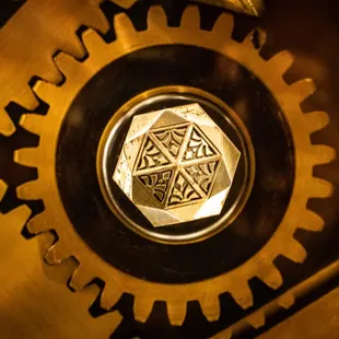 a close up of a clock with gears