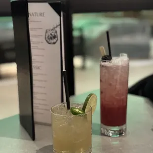 two cocktails on a table at a restaurant