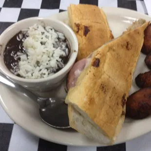 Cuban sandwich with plantains and black beans.