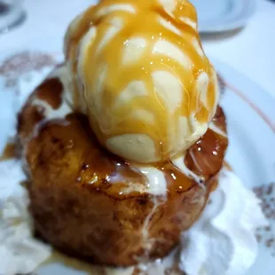 a dessert with ice cream and caramel