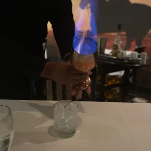 a person holding a glass of wine
