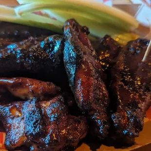 Charred grilled wings with spicy BBQ sauce