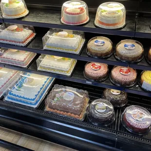 a variety of cakes on display