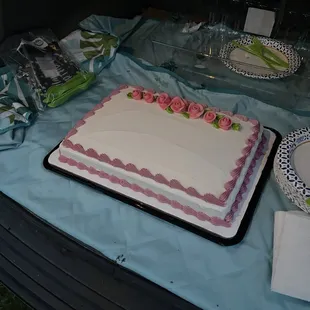 a cake with pink roses on it