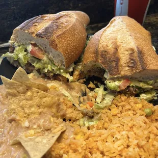 Carne asada torta combo with rice and beans