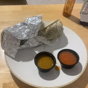 Burrito, green salsa and red salsa