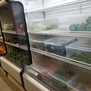 a refrigerator full of vegetables and fruits