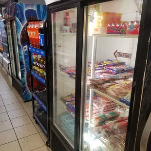 a row of refrigerators in a store