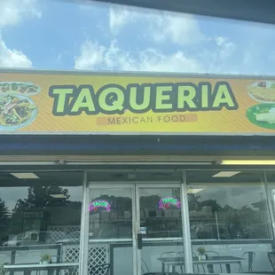 a taqueria restaurant sign