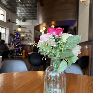 Centerpiece with Christmas tree in background.
