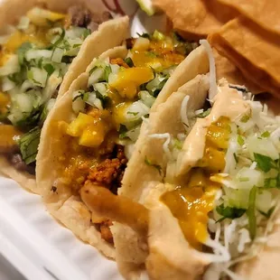 two tacos in a styrofoam container