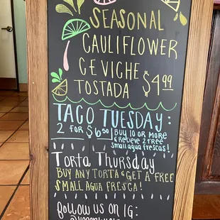 Notice board for their seasonal cauliflower ceviche tostada, taco Tuesday discount, and torta Thursday deal.