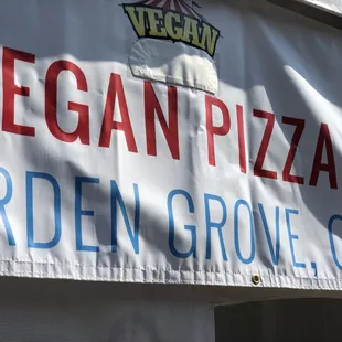 a sign that says vegan pizza garden grove ca