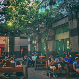 a group of people sitting on benches