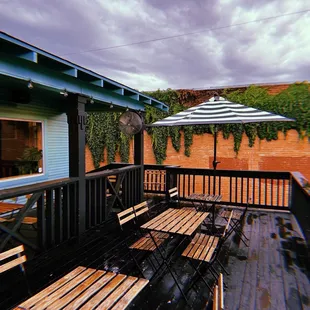 a patio with tables and chairs