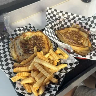 Pesto tomato grilled cheese (daily special) and jalapeño popper grilled cheese