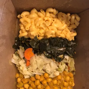 Veggie Plate with mac and cheese, collard greens, cabbage, and lentils.