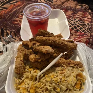 a plate of fried chicken and rice