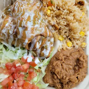 The entire meal was AWESOME! Chile reños with sides of Mexican rice and refried beans.