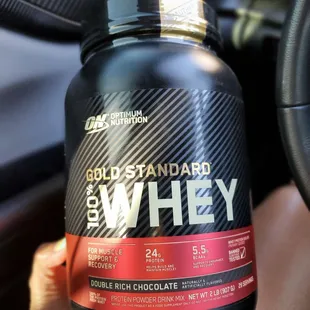 a bottle of gold standard whey