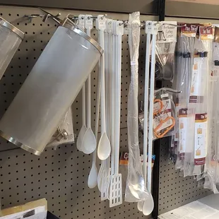 kitchen utensils hanging on a pegboard