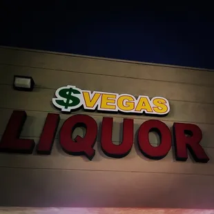 a neon sign for a liquor store