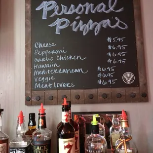 a selection of alcohol bottles on a bar counter