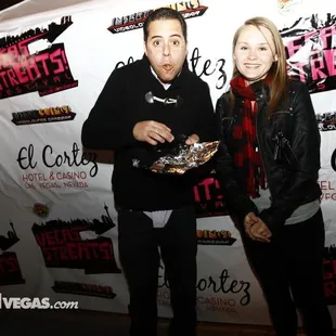 a man and a woman posing for a picture