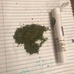 That's a half a gram of garbage and they charged me a gram. That's not even weed. It's trim and sticks and crap