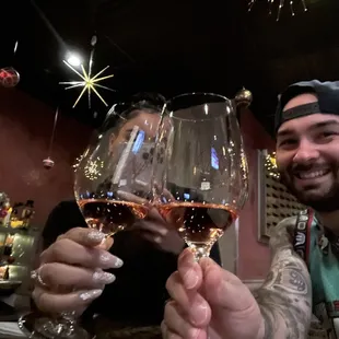a man holding a glass of wine
