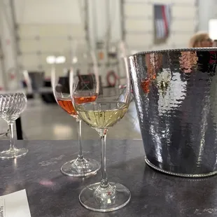 two glasses of wine and a bucket of wine