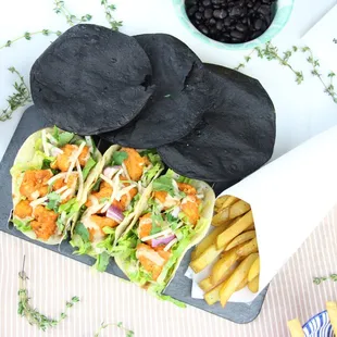 a plate of tacos and chips