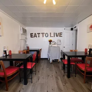 a dining room with tables and chairs