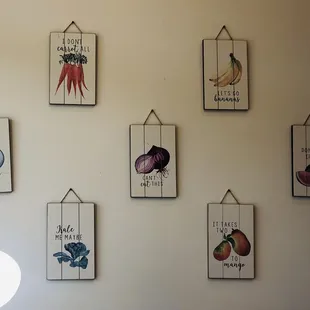 various vegetables hanging on a wall