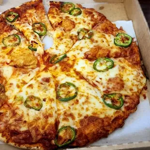 Whole wheat crust pizza with jalapenos, regular cheese