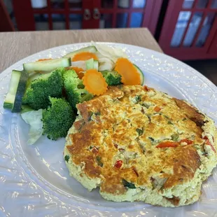 Tofu scrambled serve with steamed vegetables