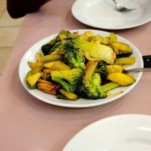 a plate of broccoli and potatoes