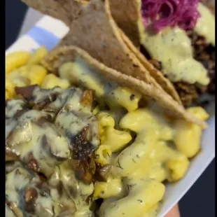Mac n&apos; cheese topped w/ bbq mushrooms.   Taco salad