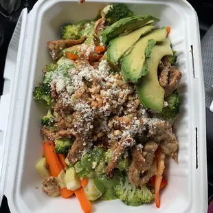 Grilled chicken based quinoa bowl w/ pistachio curry dressing and extra avocado. Delicious!