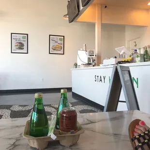 a woman sitting at a table in a restaurant