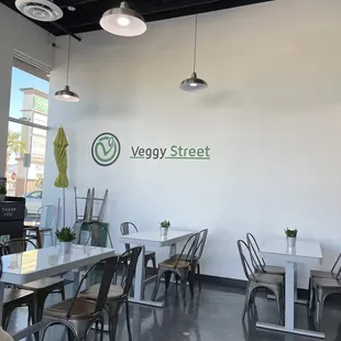 a restaurant with tables and chairs
